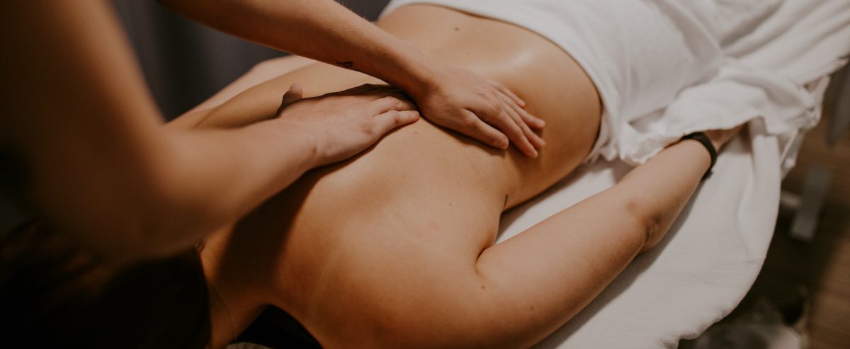 Massage Therapist performing massage on the Patient